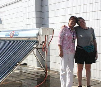 My Wife Susan with the Orphanage Director Next to the Solar Panels.